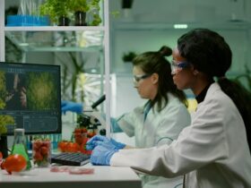 Scientists Analyzing Plants in Lab